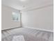 Spacious basement bedroom with grey carpet and window at 4125 River Oaks St, Castle Rock, CO 80104