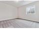 Bright basement room featuring grey carpet and window at 4125 River Oaks St, Castle Rock, CO 80104