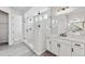 Modern bathroom with glass shower and double vanity at 4125 River Oaks St, Castle Rock, CO 80104