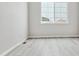 Bright bedroom with vinyl plank flooring and a window at 4125 River Oaks St, Castle Rock, CO 80104