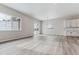 Open dining area with hardwood floors and access to a deck at 4125 River Oaks St, Castle Rock, CO 80104