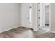 Bright entryway with vinyl plank flooring, white door, and access to a coat closet at 4125 River Oaks St, Castle Rock, CO 80104