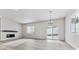 Bright and spacious living room with hardwood floors and a fireplace at 4125 River Oaks St, Castle Rock, CO 80104