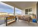 Covered back patio offers comfortable seating and outdoor living at 13362 Amber Sky St, Parker, CO 80134