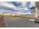 Spacious backyard with gravel, lawn, and a wooden fence at 13362 Amber Sky St, Parker, CO 80134