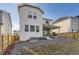 Gravel backyard, wooden fence, and covered patio at 13362 Amber Sky St, Parker, CO 80134