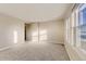 Bright, carpeted bedroom with ample natural light at 13362 Amber Sky St, Parker, CO 80134