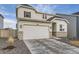 Charming home with stone accents, two-car garage, well-maintained lawn, and inviting front entrance at 13362 Amber Sky St, Parker, CO 80134