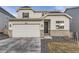 Charming home featuring a two-car garage, stone accents, manicured lawn, and welcoming front door at 13362 Amber Sky St, Parker, CO 80134