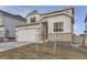 Charming home with stone accents, two-car garage, well-maintained lawn, and inviting front entrance at 13362 Amber Sky St, Parker, CO 80134