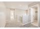Bright hallway with carpet, white trim, and doors, offering a seamless transition between spaces at 13362 Amber Sky St, Parker, CO 80134