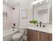 Modern bathroom with sleek fixtures, a tiled shower, and a stylish vanity, providing a spa-like experience at 1715 Grove St, Denver, CO 80204