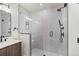 Modern bathroom with a glass shower enclosure, gray tile and a floating vanity with a sleek sink at 1715 Grove St, Denver, CO 80204