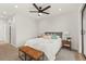 Comfortable bedroom featuring neutral walls, a ceiling fan, and a stylish leather bench at 1715 Grove St, Denver, CO 80204