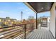 Relaxing deck with an outdoor view of the street, neighboring buildings, and blue skies at 1715 Grove St, Denver, CO 80204