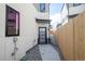 Modern townhome entrance featuring a gray door, address number 1715, and stone landscaping at 1715 Grove St, Denver, CO 80204