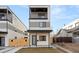 Modern two-story home with a front porch, contemporary design, and a well-maintained yard, enhancing curb appeal at 1715 Grove St, Denver, CO 80204