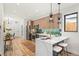 Stylish kitchen with stainless steel appliances, island with breakfast bar, and ample storage space at 1715 Grove St, Denver, CO 80204