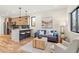 Bright and airy living room featuring hardwood floors, a modern coffee table, and comfortable seating at 1715 Grove St, Denver, CO 80204