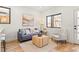 Inviting living space with comfortable armchair, modern table and sofa with lots of natural light at 1715 Grove St, Denver, CO 80204