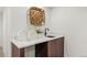 Wet bar area with stylish cabinetry, a marble countertop, and modern fixtures, perfect for entertaining guests at 1715 Grove St, Denver, CO 80204