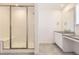 Modern bathroom showcasing a glass-enclosed shower and a sleek vanity at 39856 Floyd St, Elizabeth, CO 80107