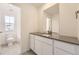 Bright bathroom featuring a gray countertop, white cabinets, and modern fixtures at 39856 Floyd St, Elizabeth, CO 80107