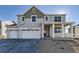 Charming two-story home with a three-car garage and covered front porch at 39856 Floyd St, Elizabeth, CO 80107