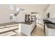 Elegant kitchen boasts an island, stainless steel appliances, and an open floor plan at 39856 Floyd St, Elizabeth, CO 80107