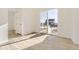 Bright room with wood flooring, a sliding glass door, and exterior views at 39856 Floyd St, Elizabeth, CO 80107