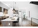 Bright kitchen with island seating and dining area features modern finishes and fixtures, creating a functional and stylish space at 4044 W 16Th Ave, Denver, CO 80204