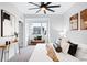 Bright main bedroom featuring a ceiling fan, a window nook, and modern decor at 4044 W 16Th Ave, Denver, CO 80204