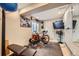 Functional exercise room with workout equipment, including a stationary bike and weight bench at 10528 Applebrook Cir, Highlands Ranch, CO 80130