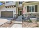 Charming home featuring a stone-accented facade, garage, and inviting front entrance at 10528 Applebrook Cir, Highlands Ranch, CO 80130