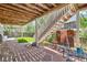 Charming stone patio with wooden stairs and outdoor seating, perfect for relaxation at 10528 Applebrook Cir, Highlands Ranch, CO 80130
