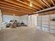 Unfinished basement with exposed ceiling, shelving, and walls ready for customization at 13804 W 61St Cir, Arvada, CO 80004