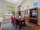 Bright dining room with large windows and adjacent to full hutch at 13804 W 61St Cir, Arvada, CO 80004