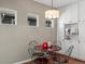 Cozy breakfast nook with natural light, a modern light fixture, and custom cabinets for storage at 13804 W 61St Cir, Arvada, CO 80004