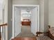 View of the main bedroom through double doors; it includes a ceiling fan and bright windows at 13804 W 61St Cir, Arvada, CO 80004