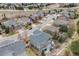 An aerial view shows the home situated in a residential neighborhood at 7329 Arco Iris Ln, Castle Pines, CO 80108