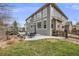 Spacious backyard patio with comfortable seating and beautifully landscaped surroundings at 7329 Arco Iris Ln, Castle Pines, CO 80108