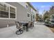 Outdoor patio featuring a dining set, lounge chairs, and a landscaped yard at 7329 Arco Iris Ln, Castle Pines, CO 80108