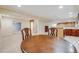 Spacious basement with a bar and dining area, perfect for entertaining at 7329 Arco Iris Ln, Castle Pines, CO 80108