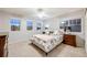 Comfortable bedroom featuring neutral walls, plush carpet, and great natural light at 7329 Arco Iris Ln, Castle Pines, CO 80108