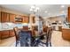 An elegant dining area with rich wood cabinetry and stylish upholstered chairs at 7329 Arco Iris Ln, Castle Pines, CO 80108