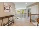 Upstairs hallway with wrought iron railing and views of the landscape through large windows at 7329 Arco Iris Ln, Castle Pines, CO 80108