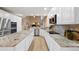 Contemporary kitchen with white cabinets, stainless steel appliances, and granite counters at 7329 Arco Iris Ln, Castle Pines, CO 80108