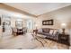 Open-concept living and dining area with hardwood floors and lots of natural light at 7329 Arco Iris Ln, Castle Pines, CO 80108