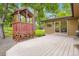 Backyard with a playhouse, deck, and access to the house through a sliding glass door at 1048 N Columbine St, Golden, CO 80403