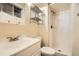 Functional bathroom with shower stall, metal shelving, and a sink with vanity at 1048 N Columbine St, Golden, CO 80403